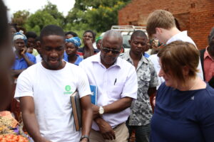 Phiri in Oxfam T-Shirt,stressing a point to Joanna and on the middle,John Makina