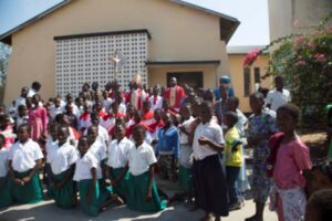 Bishop Musikuwa poses with some of the children