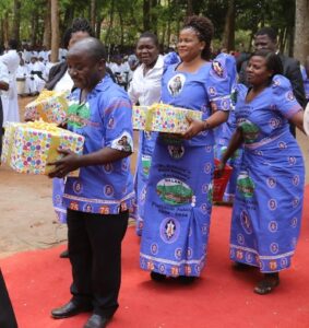 ECM members of staff with their gifts