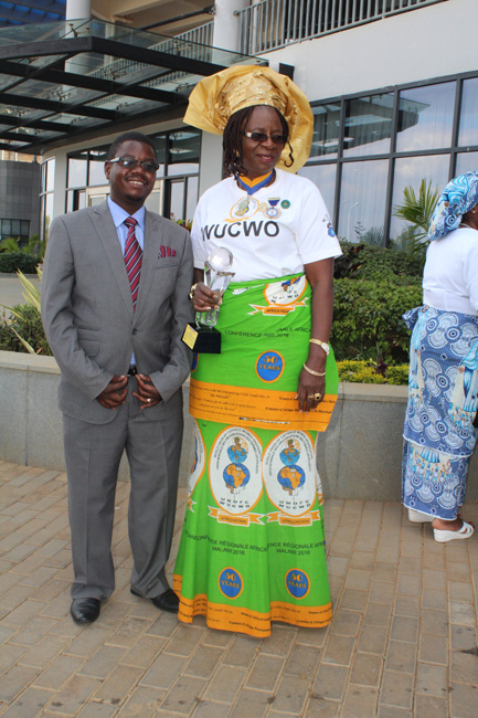 Here-we-are,WUCWO-African-President-poses-with-Prince-Henderson-after-she-was-recognised-and-awarded-for-her-service-by-Her-Excellency-Madam-Gertrude-Mutharika